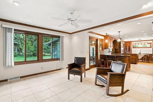 Family room off of the kitchen with large windows for viewing the backyard