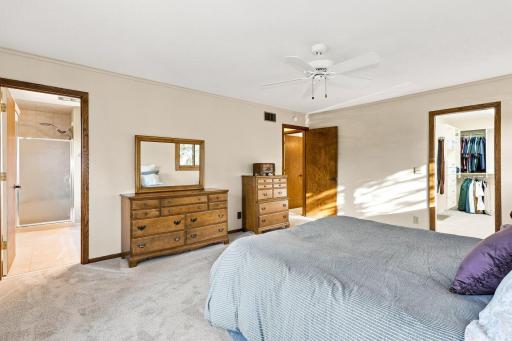 Primary bedroom view shows private bath and large walking closet that connects to the upper level laundry room