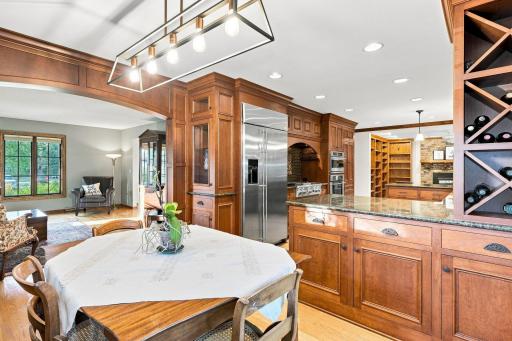 Dinning area looking into the living area and kitchen. Featuring extra storage, built-ins and beautiful woodwork.