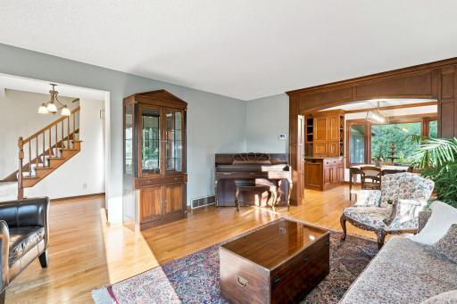 Living room looking to the stairs leading to the upper level and dinning area