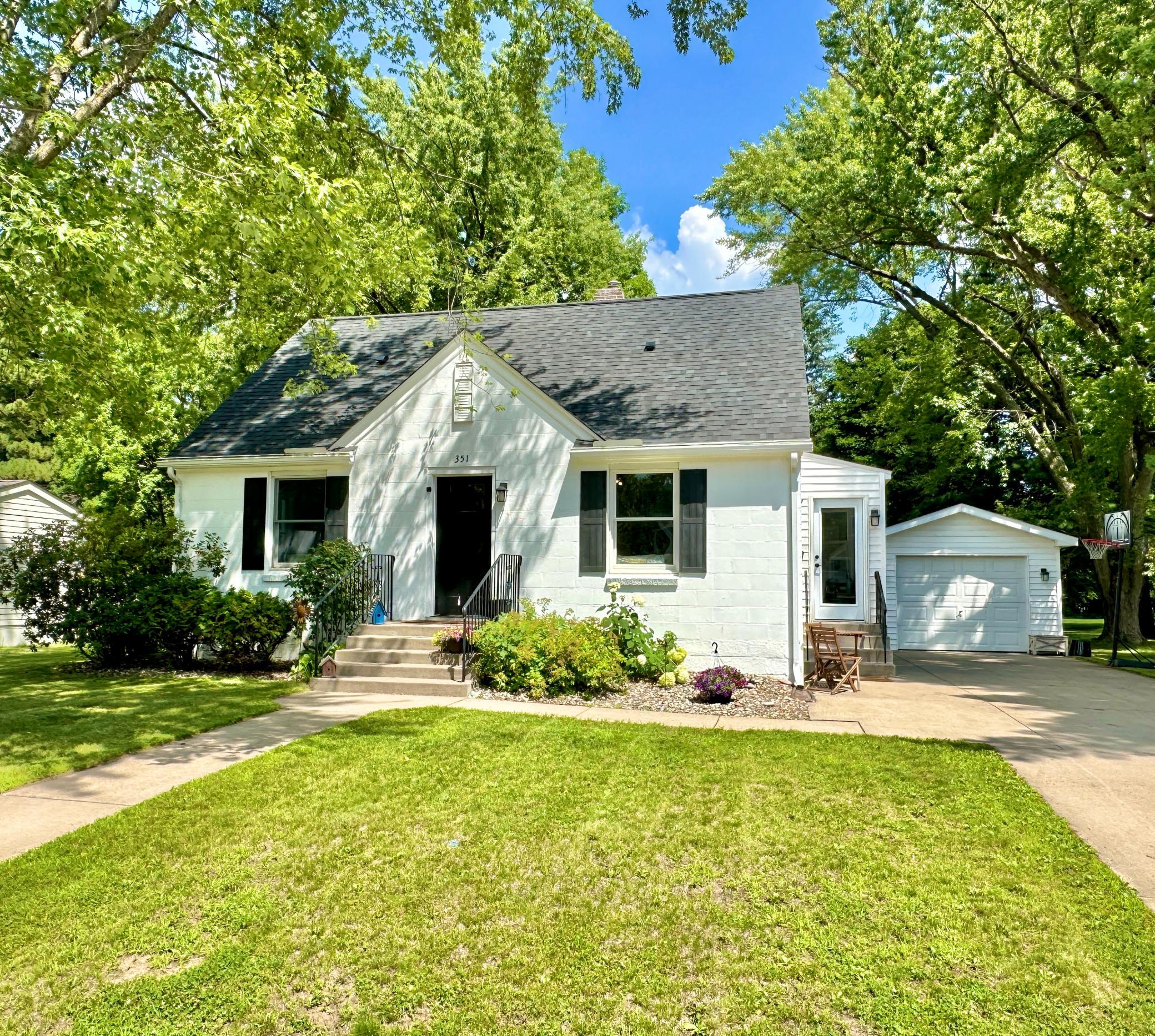 Cute and updated, this great buy home sits on .50 acres in New Richmond with a wooded back drop for privacy and Mary Park beyond that.
