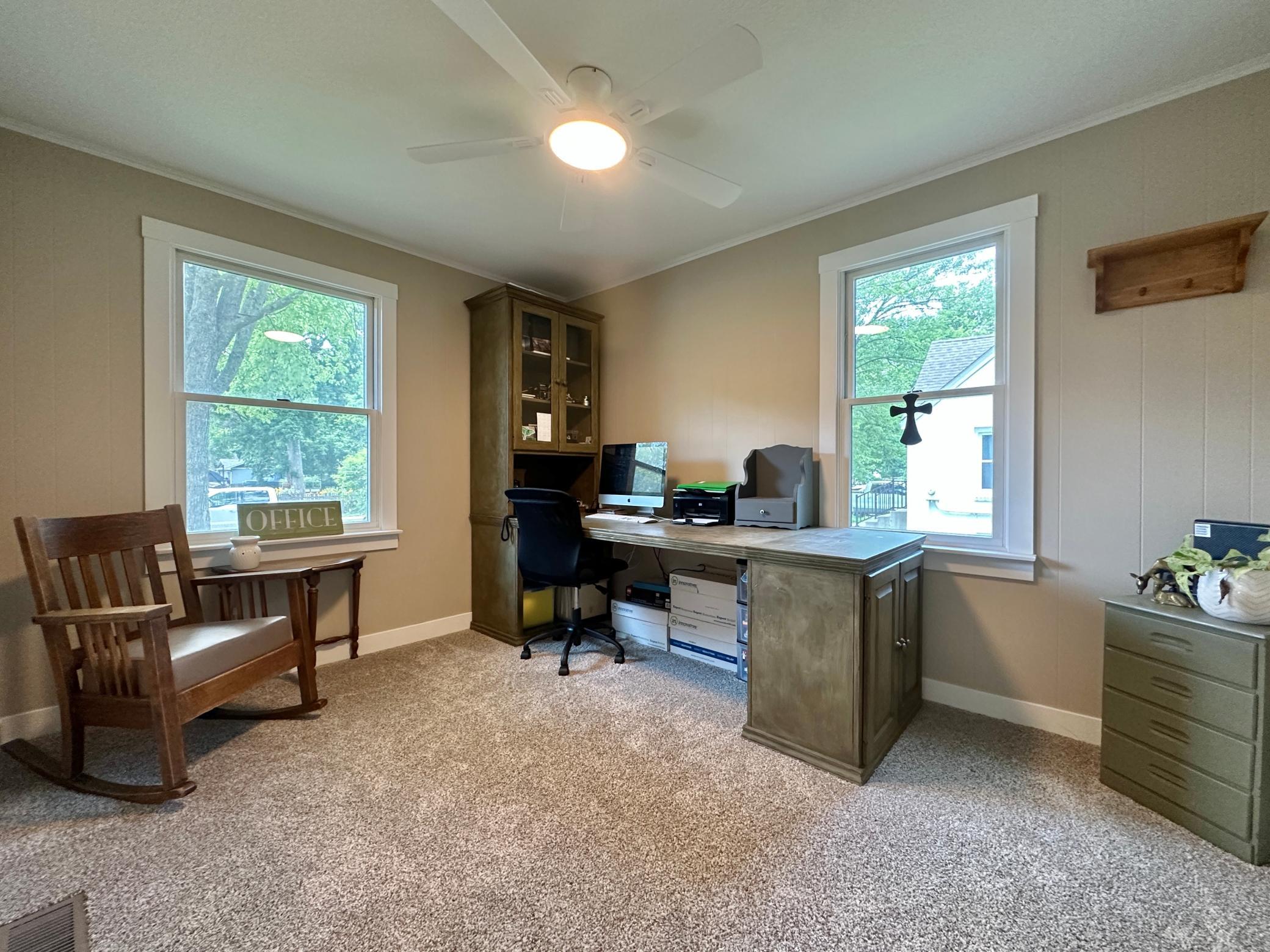 Just off the living room is this great room for an office. It would be a wonderful bedroom as well.