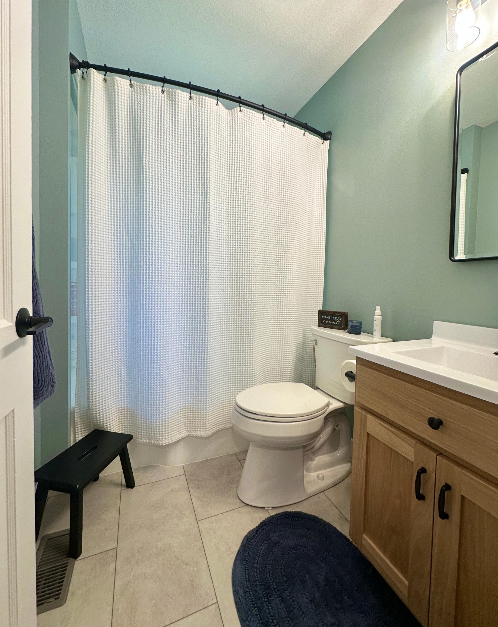 The bath in the lower level has tile floors and is a 3/4 bath.