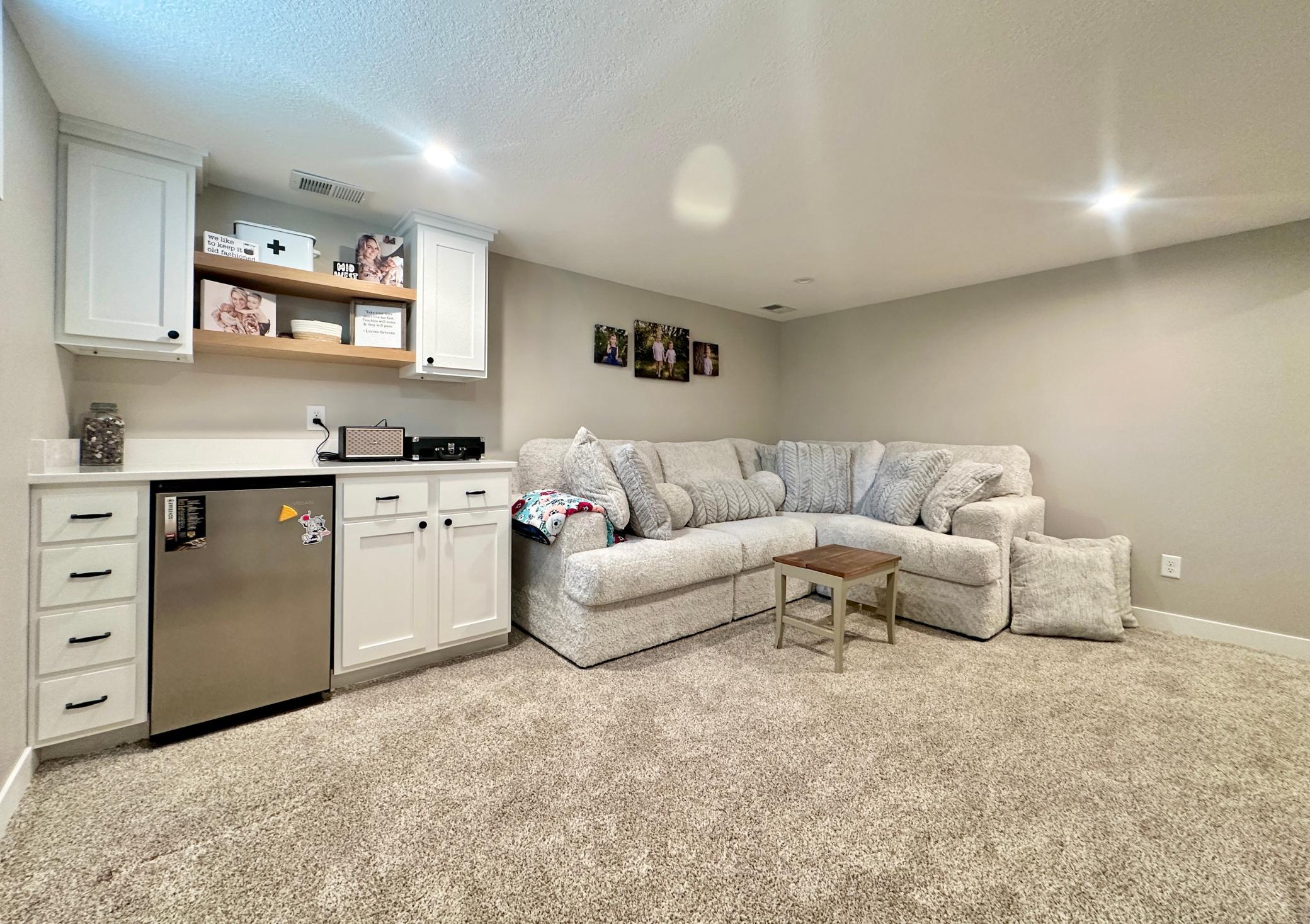 What really makes this room warm and fuzzy is the built in cupboards with mini fridge.