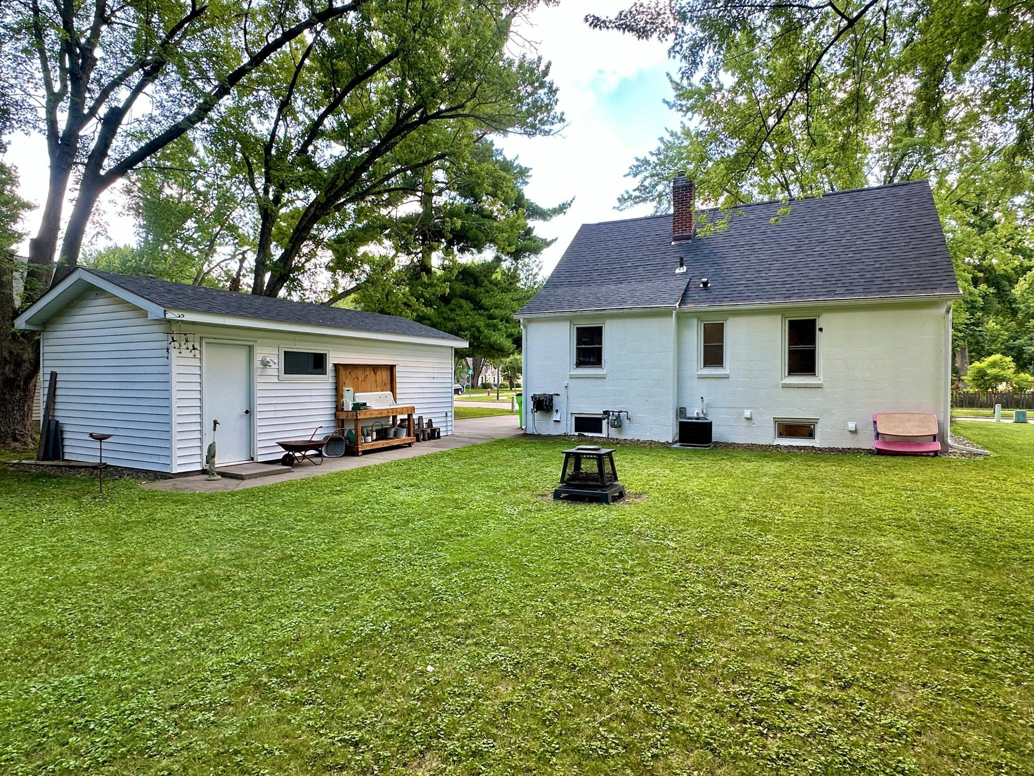 Views of the back of the home and garage, only thing missing is your family.