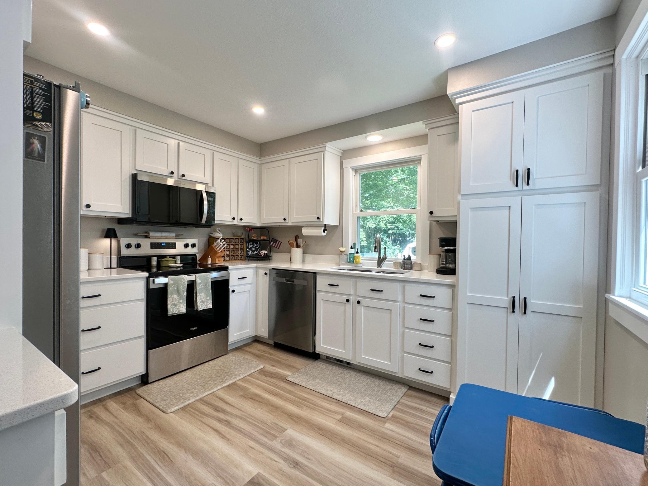 This newer LVP flooring runs through the entire main level with stainless appliances.