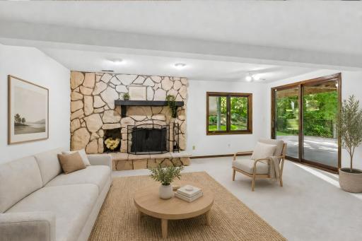Family room lower level walkout - virtually staged