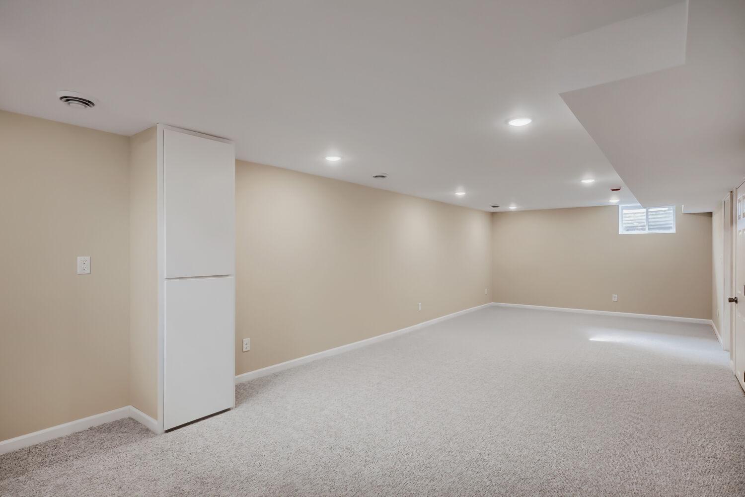 7711 Division St - This 32 x 12 space has endless possibilities: a playroom for kiddos and pets, home theater and beverage bar, private home office, and more.