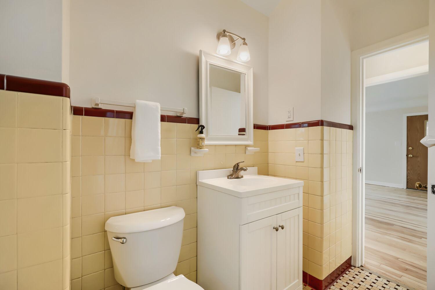 7711 Division St - Check out the gorgeous vintage "basket weave" tile!