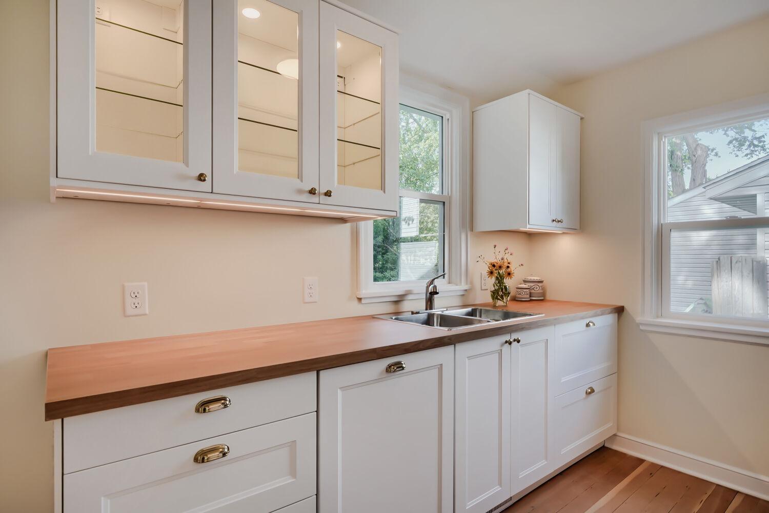 7711 Division St - Foodies will appreciate the fully remodeled kitchen featuring soft close cabinets, under counter/cabinet lighting, and food pantry.