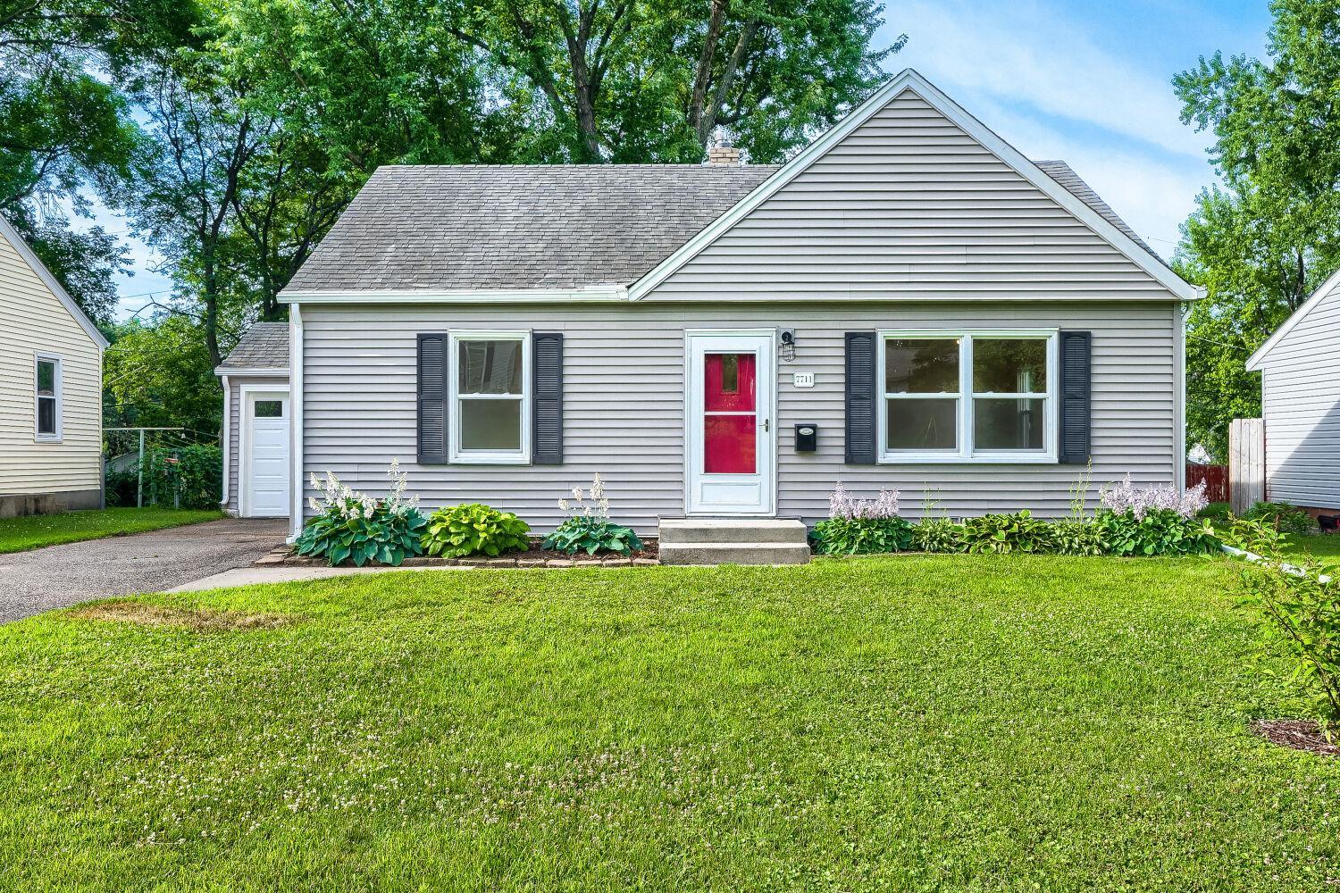 7711 Division St - This darling 3 bed/2 bath rambler is just waiting for you to call it home!