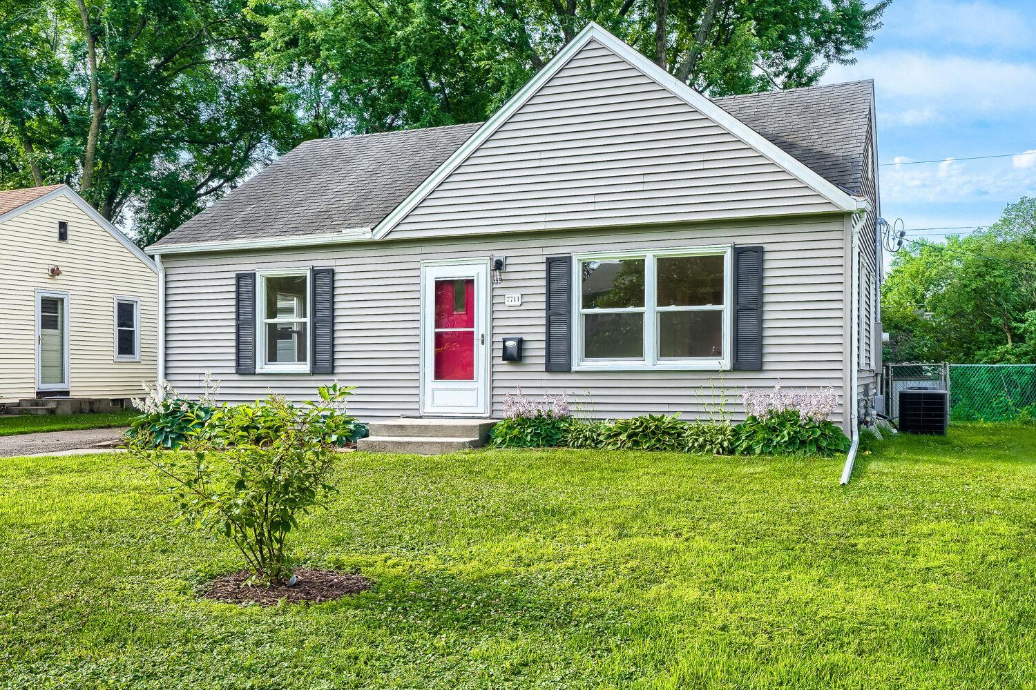 7711 Division St - Oozing curb appeal with all new windows and new front screen door.