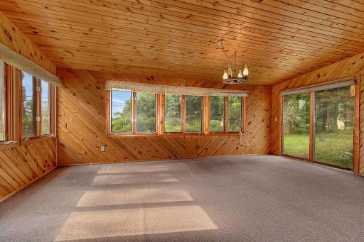 Three Season Room with Sliding Doors to Back Yard and Upper Deck