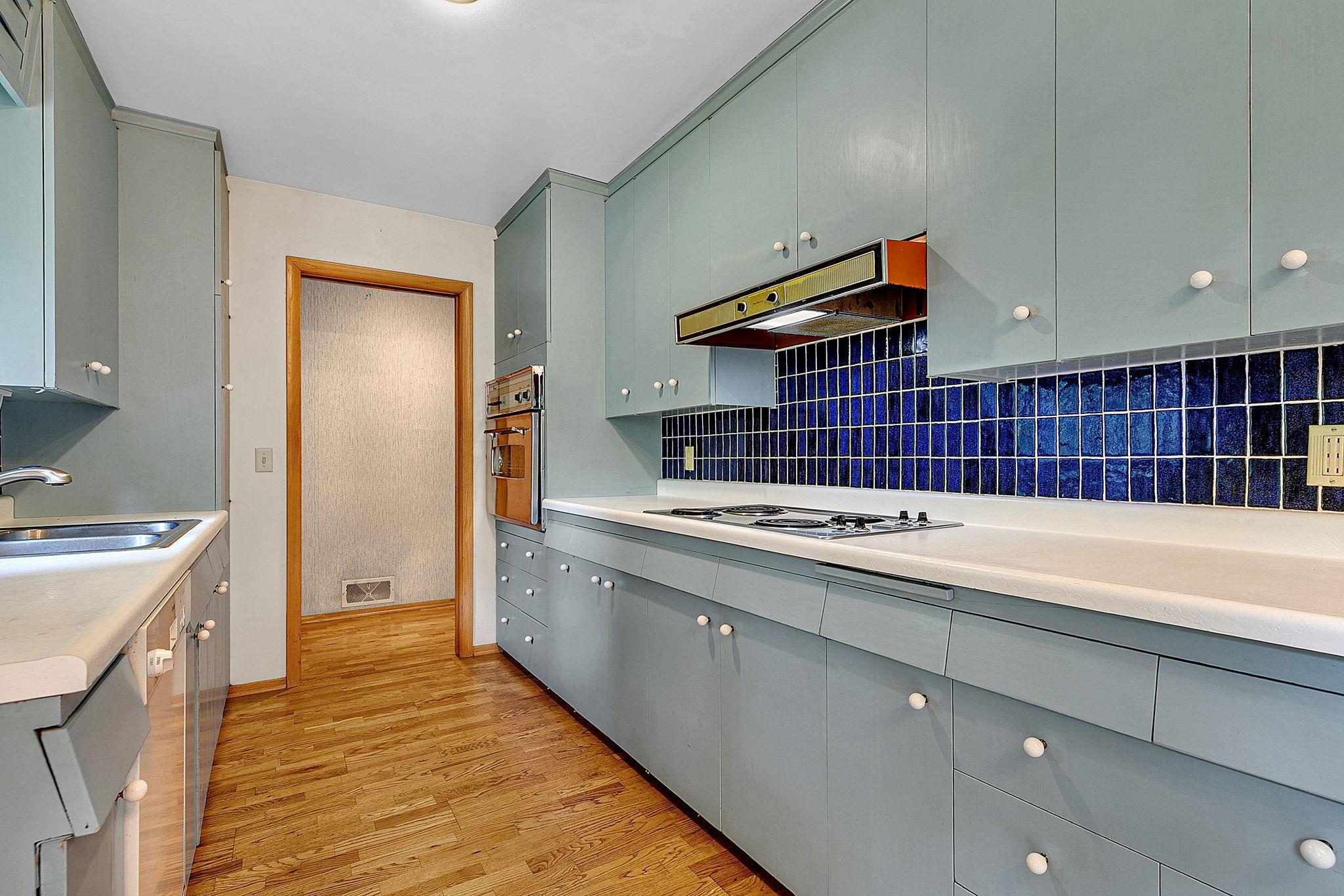 Tiled Back Splash - Wall Oven - Window Floods the Space with Natural Light