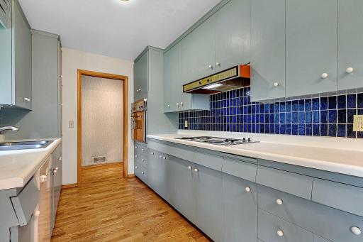Tiled Back Splash - Wall Oven - Window Floods the Space with Natural Light