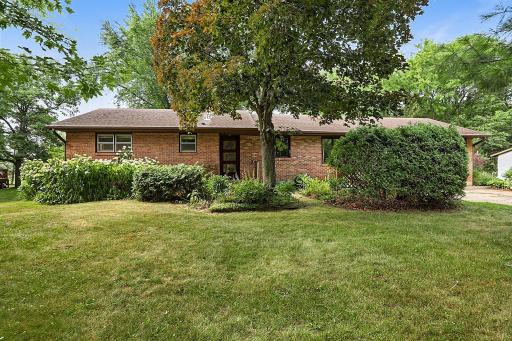 Brick Exterior - Charming Front Door -Concrete Driveway