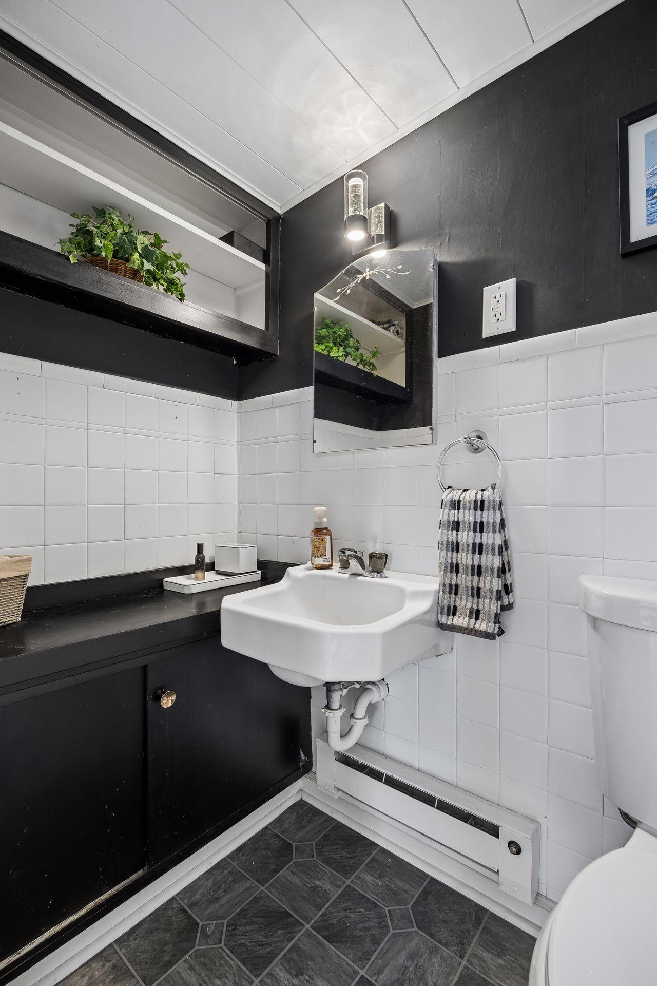 A private half bath completes the upper-level primary retreat.