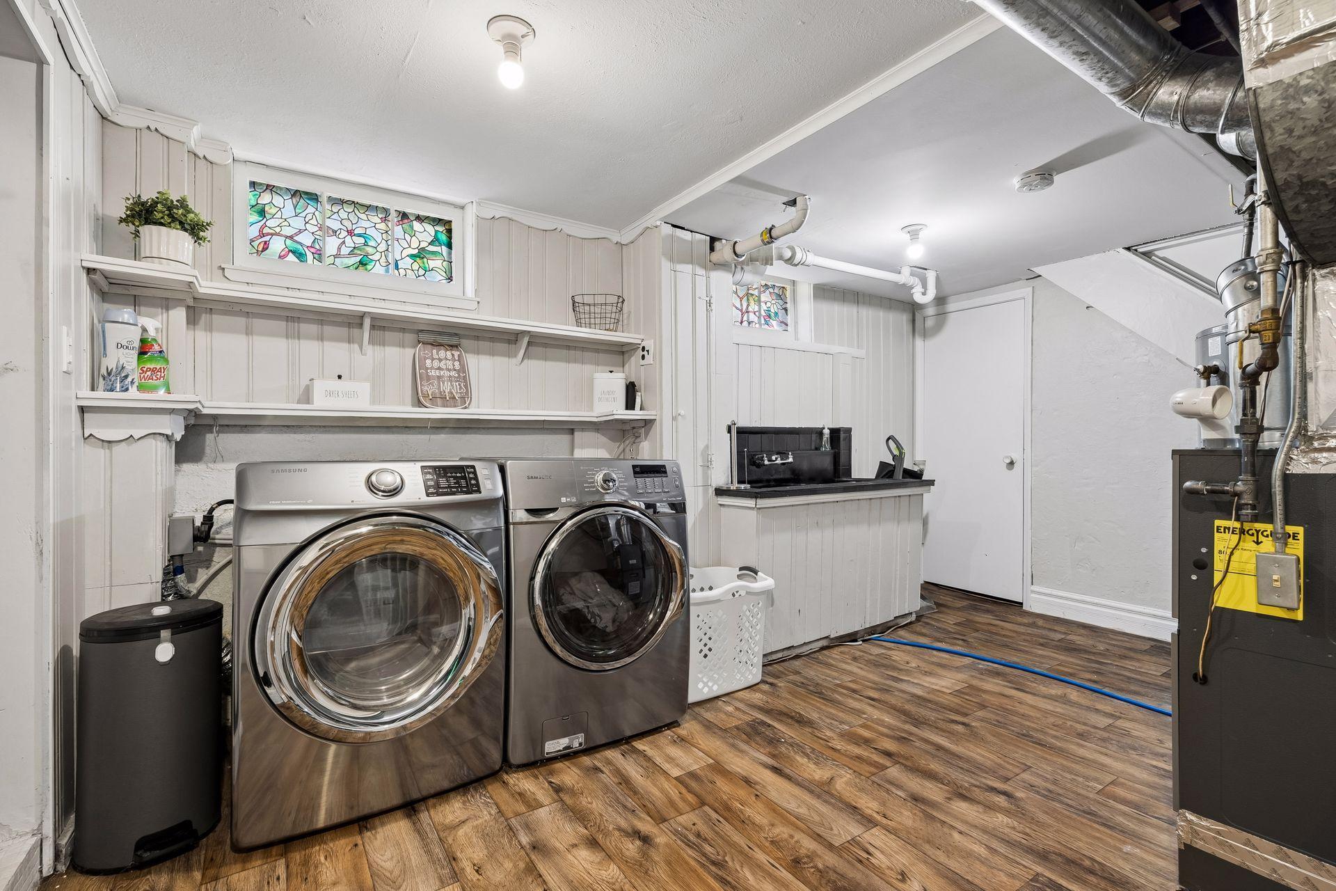 A generous laundry and utility area provides abundant storage and workspace, helping keep the rest of the home organized.