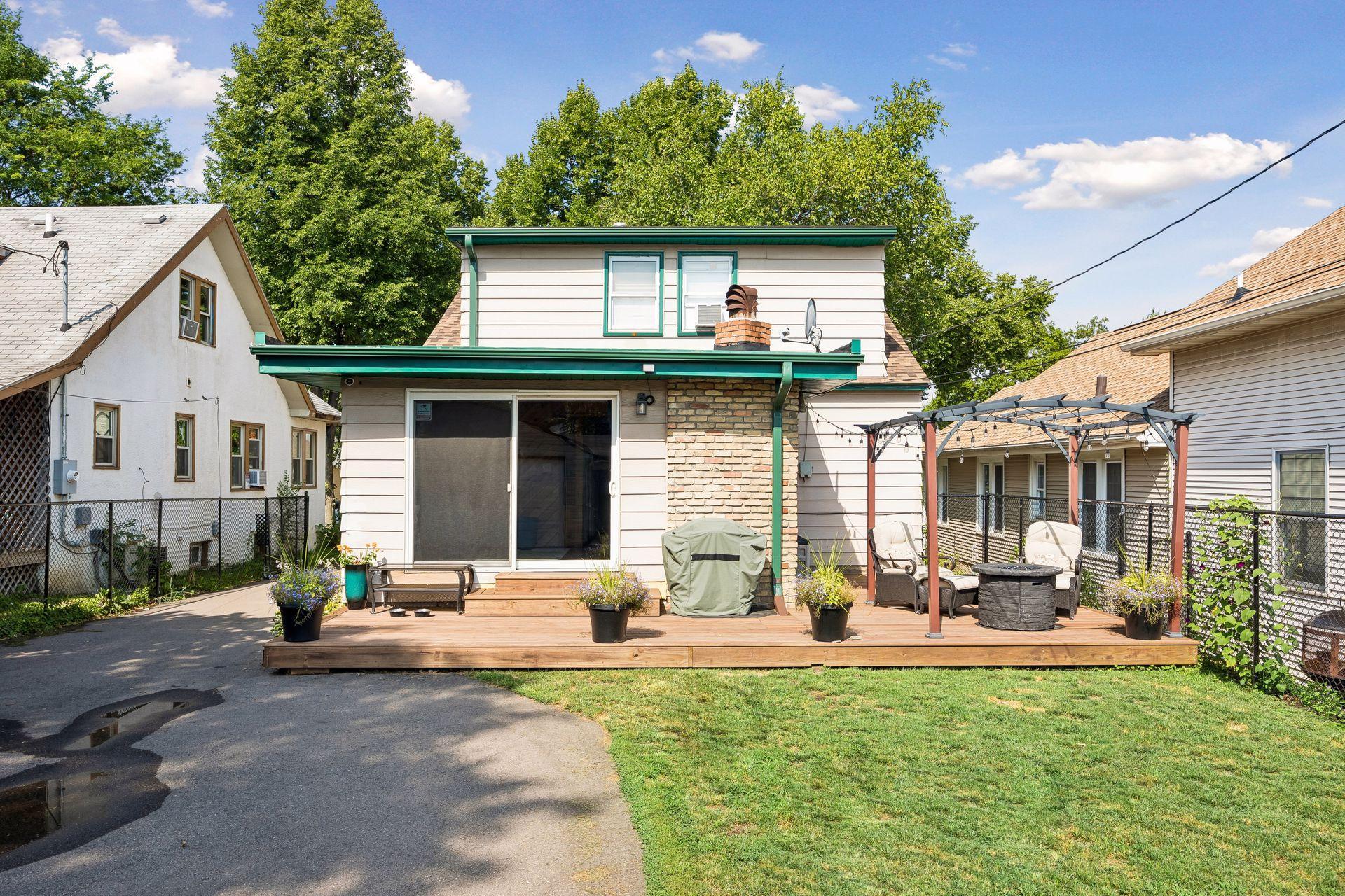 Outdoor living made easy. The expansive new deck is the perfect place to grill, entertain, or simply unwind while overlooking the fully fenced backyard. Please note the pergola will be retained by the sellers.