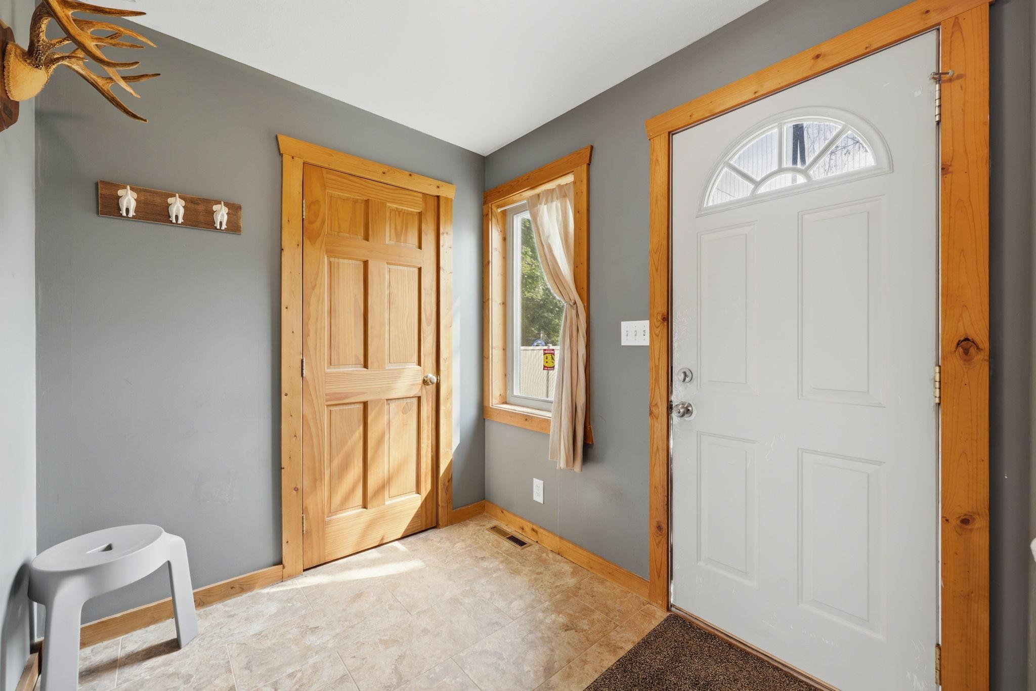 Spacious mudroom entry off backyard