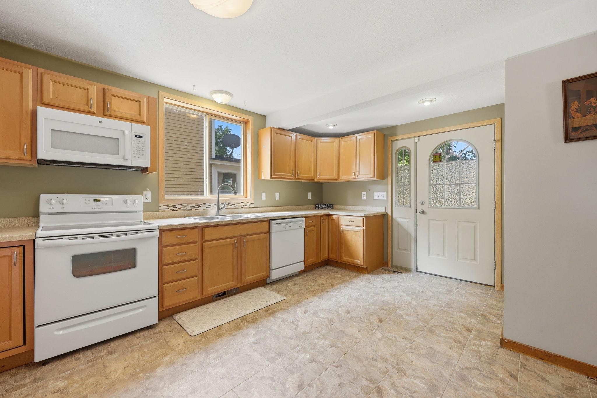 New luxury vinyl tile in kitchen, entry and bathroom in early 2026
