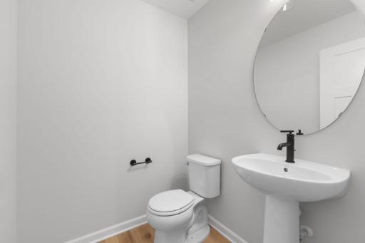 Main level powder bath. Photo used for layout purposes. Finishes may be different.
