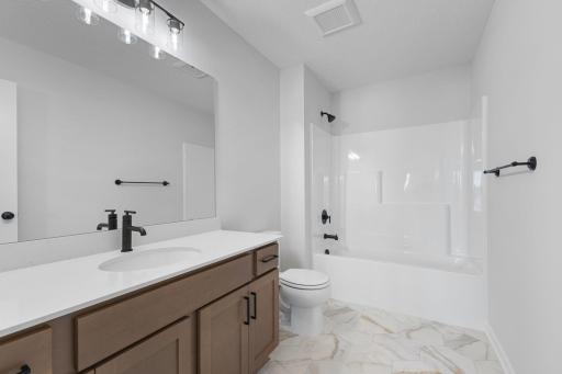 Upstairs full bath. Photo used for layout purposes. Finishes may be different.