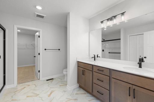 Owner's bath with dual sinks, large shower, spacious! Large walk-in closet! Photo used for layout purposes. Finishes may be different.