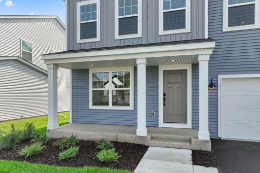 The Waterbury front porch. Pic is an example only of exterior. Exterior color selections of home are different (see exterior color selection pic) and landscaping may have variations.