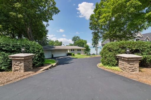 Expansive driveway as you enter the home with additional parking to the right