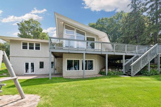 Large wrap around deck and patio off the back of the home to enjoy views of the lake