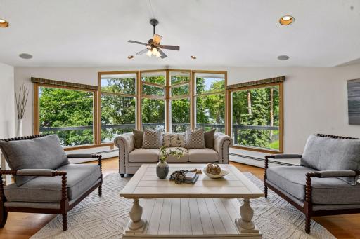Expansive windows fill the living room with natural light