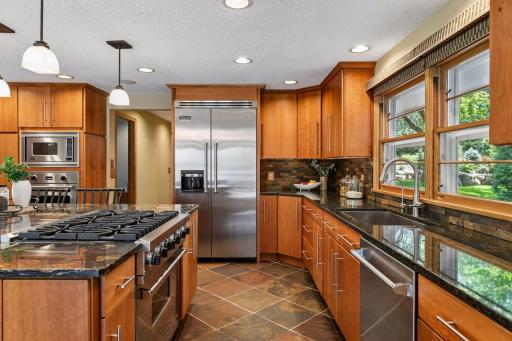 Gourmet kitchen provides gas range and double ovens