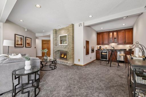 Fireplace and additional wet bar compliment the lower level