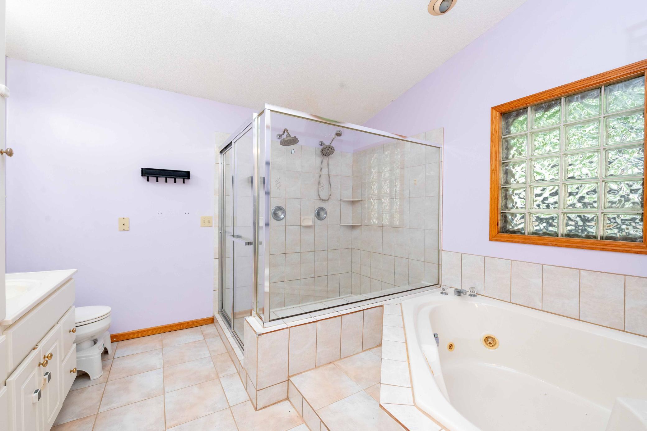 Primary walk-in shower with double shower heads
