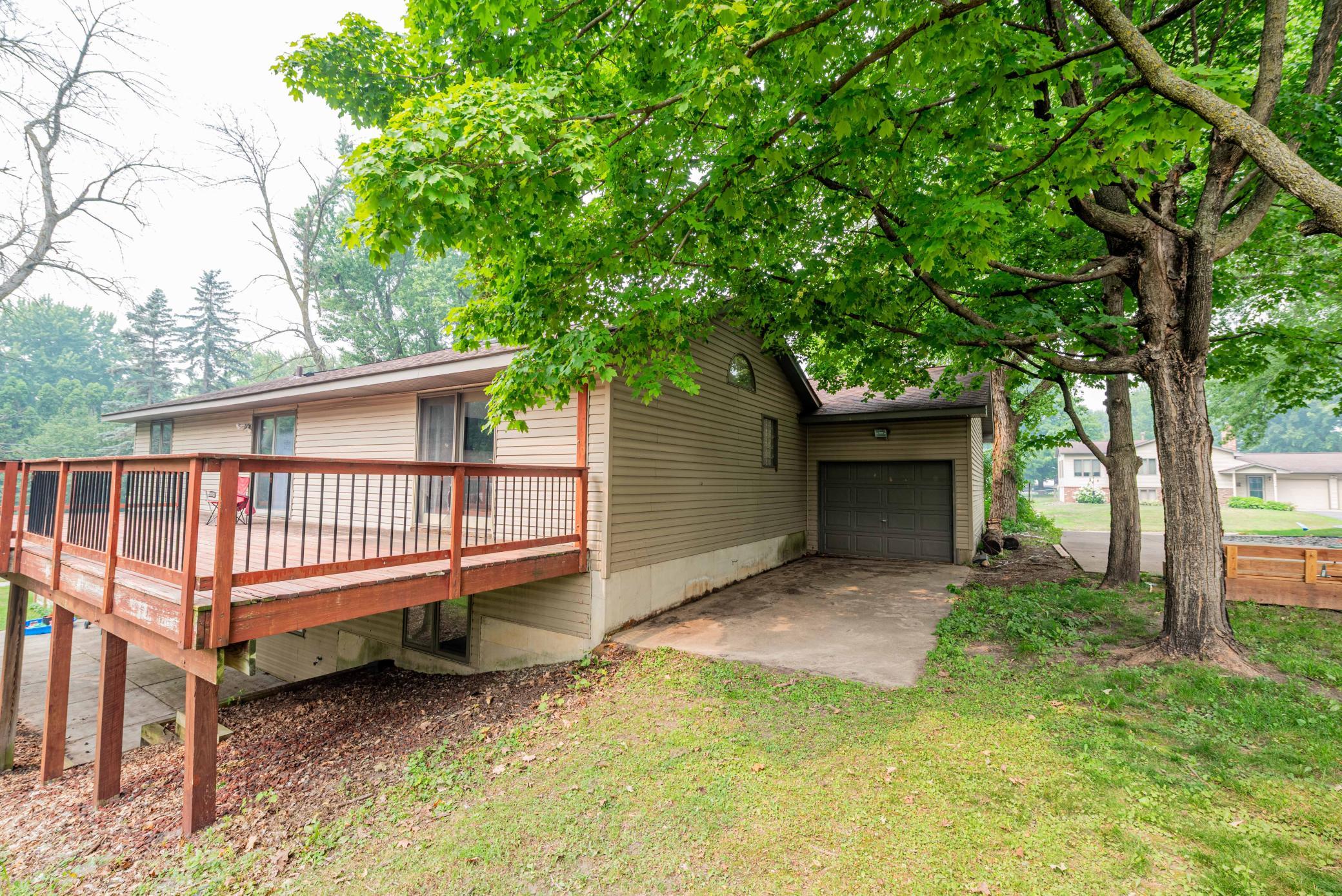 Pass thru garage door on 3rd stall with generous size concrete parking pad