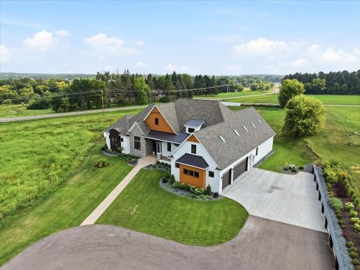 4 Acres with private drive to circular driveway and side garage access