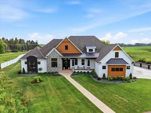 4 Acres with private drive to circular driveway and side garage access