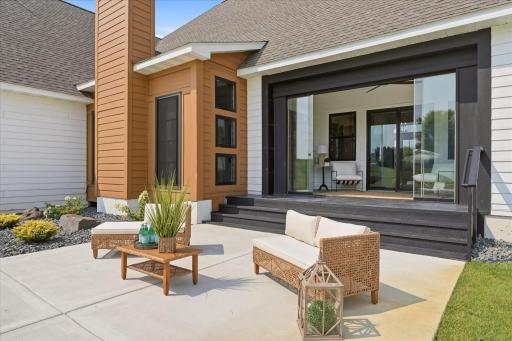 Retractable glass wall to create and indoor-outdoor experience from this sunroom connecting the home to the pool and patio