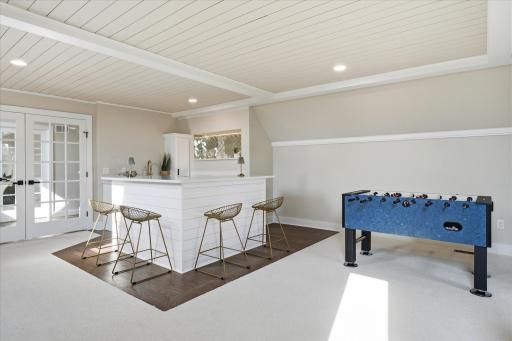 The entertainment loft includes rec room with full bar and half bath
