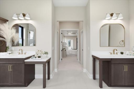 Spa-inspired with separate vanities, soaking tub, and tiled walk-in shower