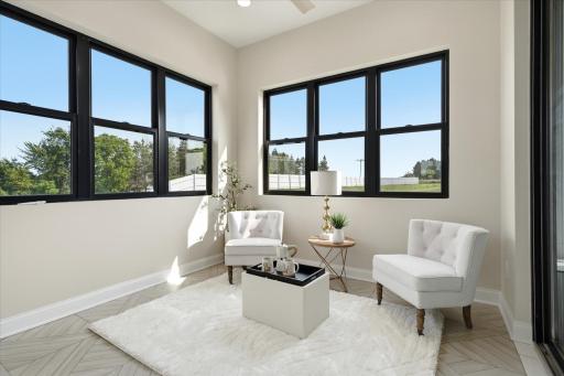 Owner's private sitting room/sunroom with heated floor and porch, patio + pool access