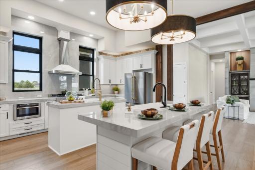 Stunning kitchen with 12 foot ceilings, expansive spaces for food prep, serving, and entertaining