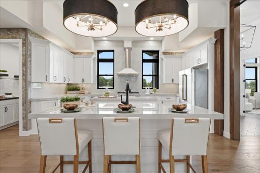 Stunning kitchen with 12 foot ceilings, expansive spaces for food prep, serving, and entertaining
