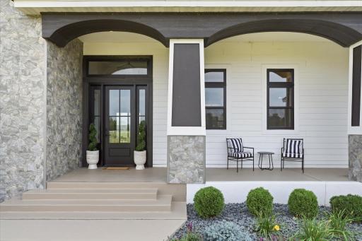 Welcome your guests from this covered front porch