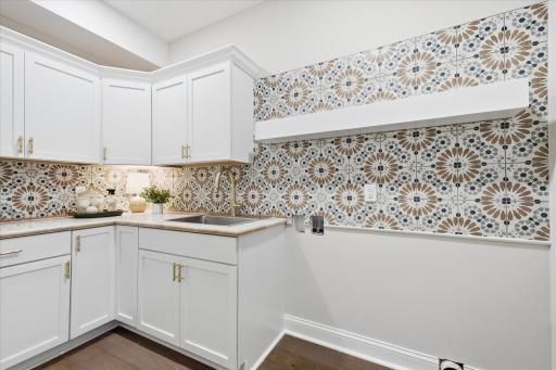 Chic laundry room conveniently located by bedrooms