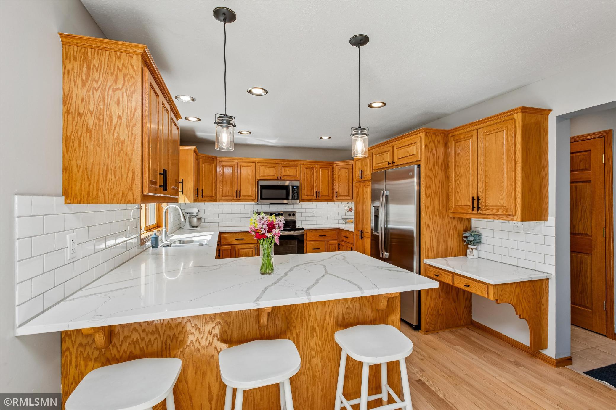 Beautiful updated kitchen with breakfast bar seating.