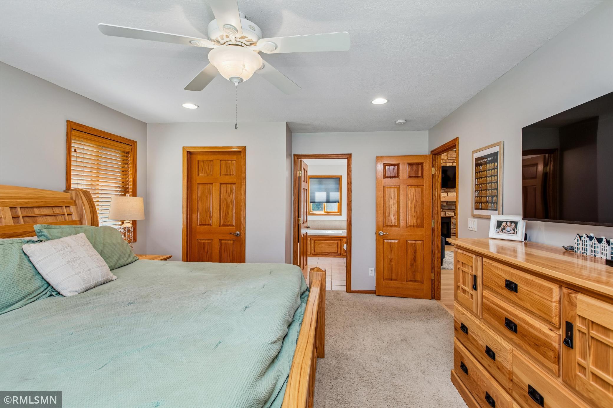 Primary bedroom with full bath and walk in closet
