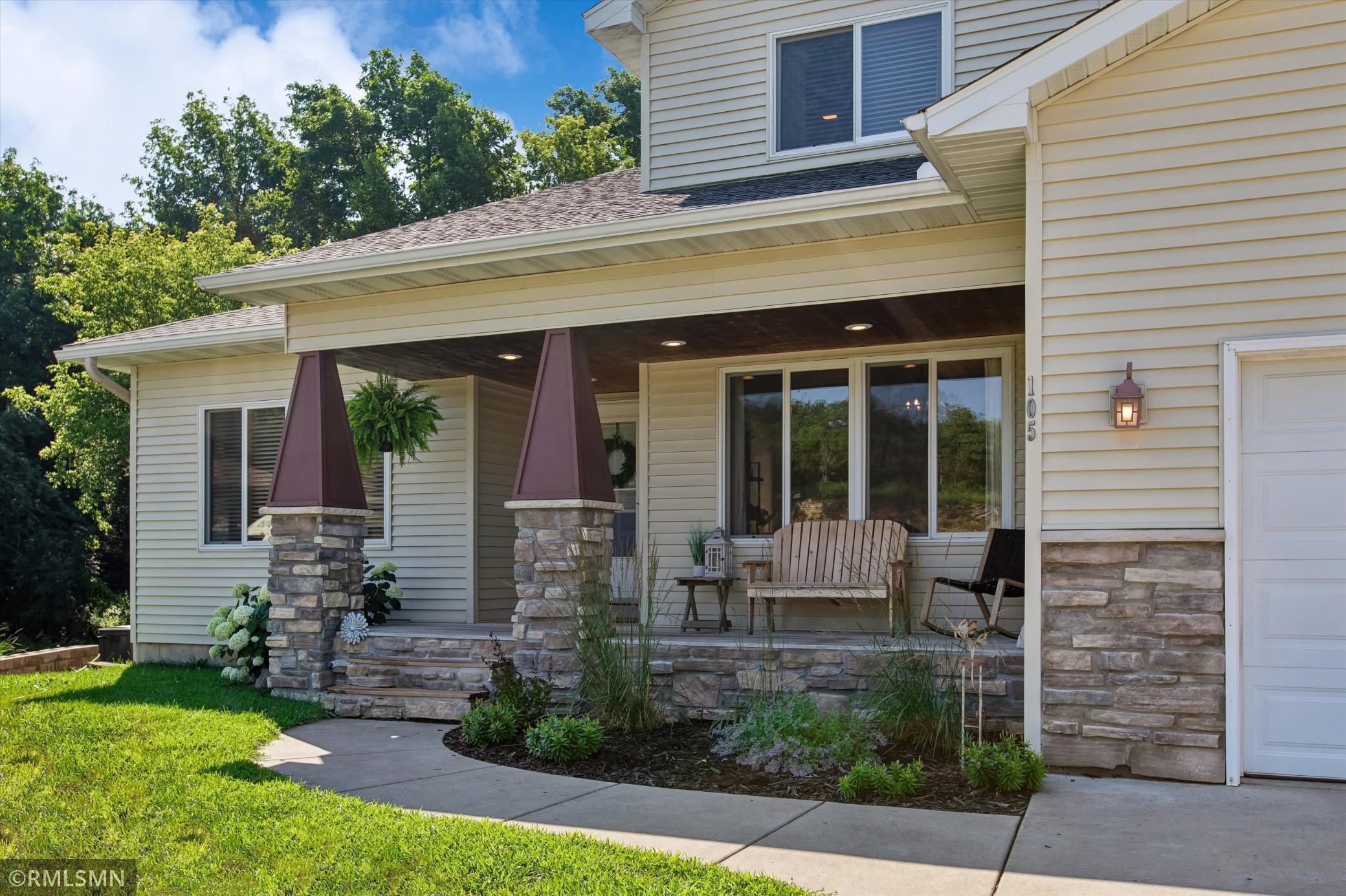 Beautiful front porch to sit and enjoy your morning coffee and a good book!