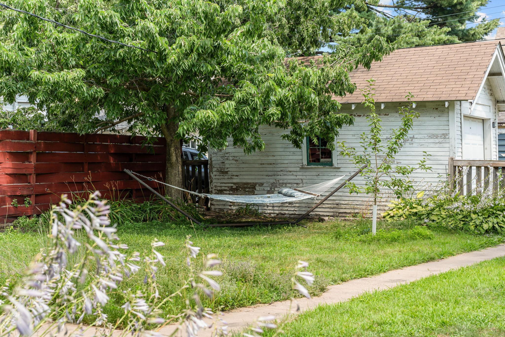 Quiet backyard with pollinator gardens and apple trees
